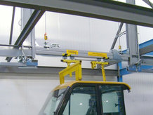 Overhead Monorail System with hydropneumatic swivel and lifting station in a paint shop and the assembly area of a car cabin manufacturer